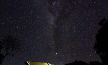 milky way galaxy under yellow camping tent