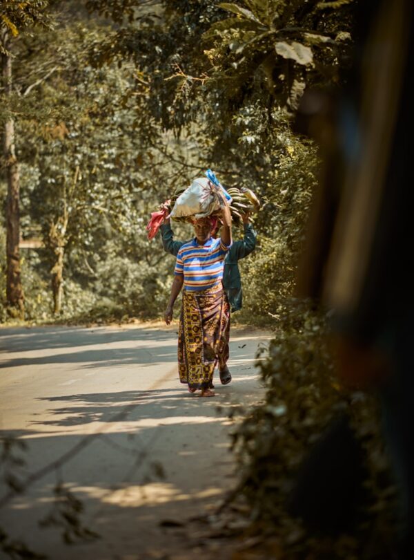 a person carrying a child on the back