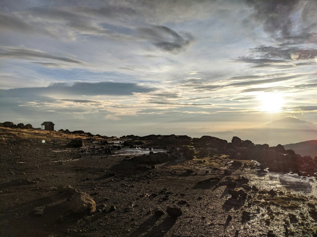 rocky shore under cloudy sky during daytime